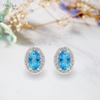 Oval Cut Swiss Blue Topaz & Diamond Halo Earrings in 14K Gold