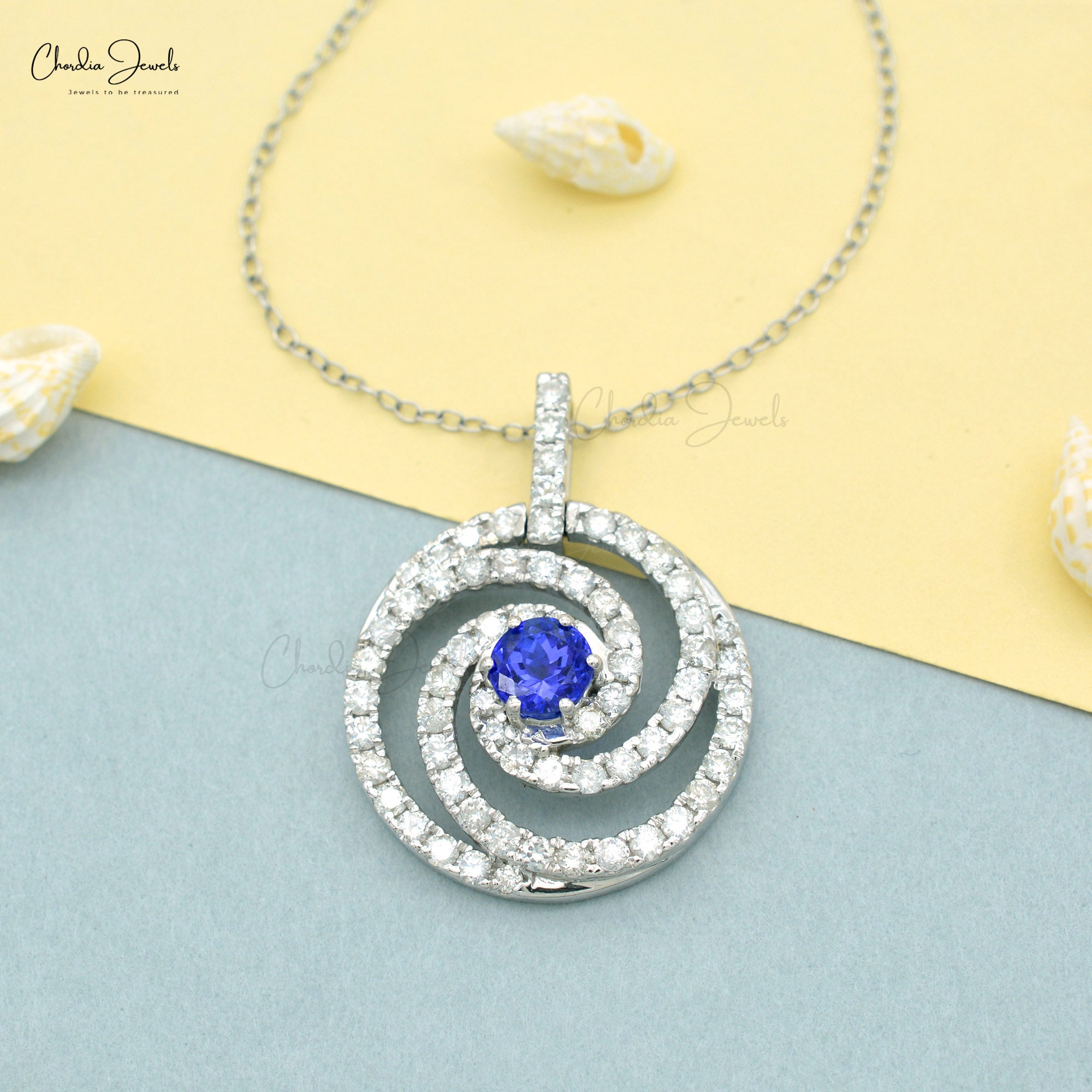 Swirl Diamond Halo Pendant With 6mm Tanzanite Prong Set In 14k White Gold Spiral Pendants