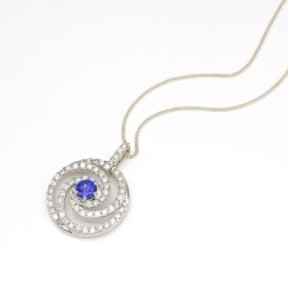 Swirl Diamond Halo Pendant With 6mm Tanzanite Prong Set In 14k White Gold Spiral Pendants